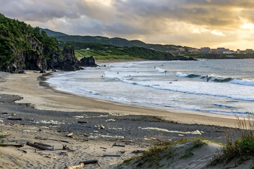 Waves and cliffs at Jungmun Saekdal Beach on Jeju's resort coast