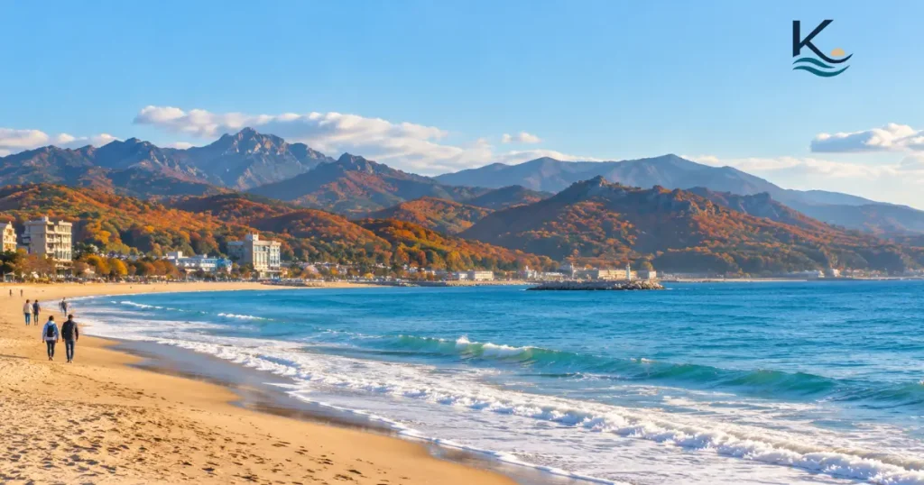 Autumn foliage on the mountains behind the East Sea near Sokcho, with a quiet beach in the off-season