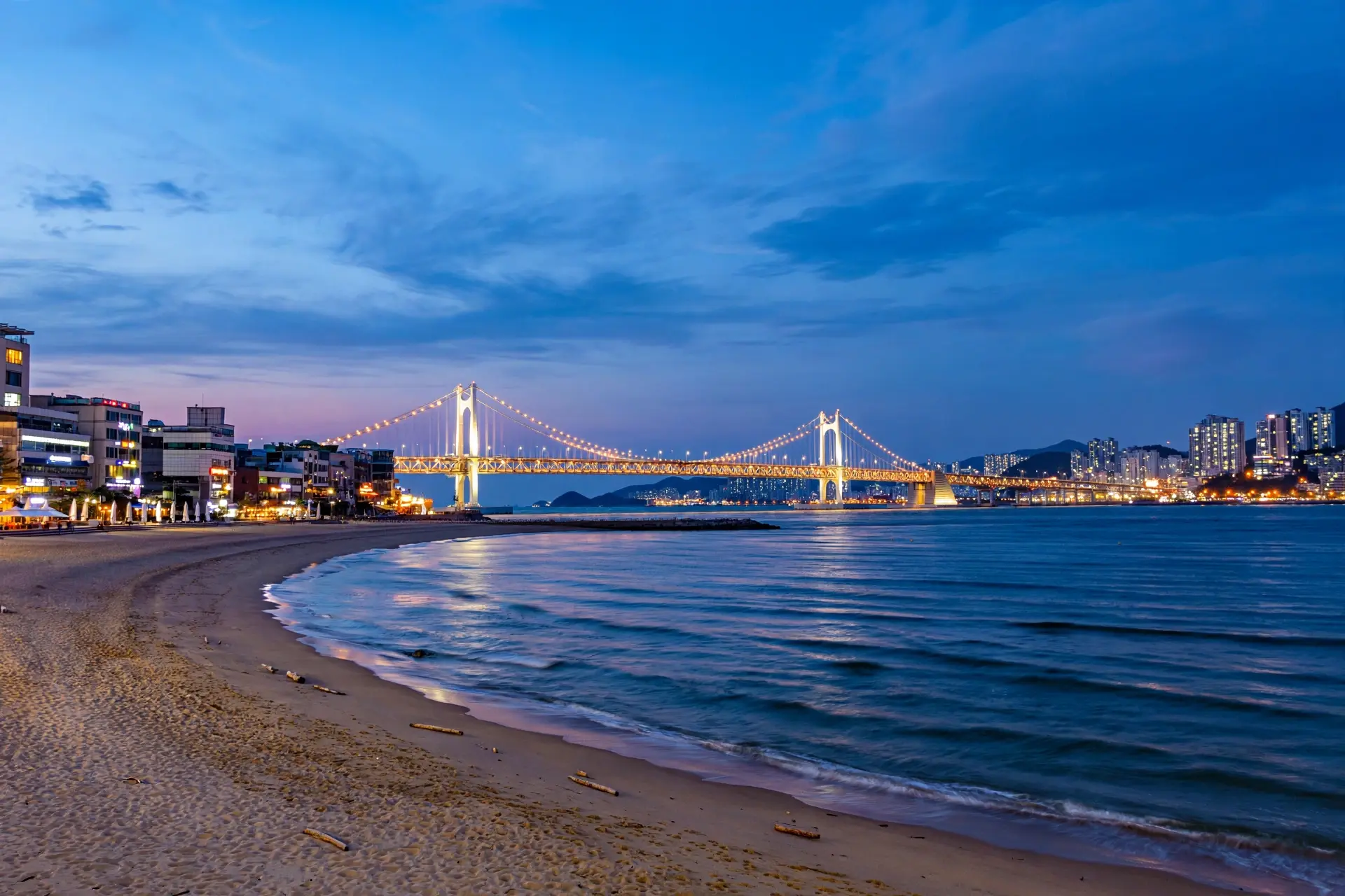 Gwangalli Beach and Gwangandaegyo Bridge at sunset in Busan, South Korea
