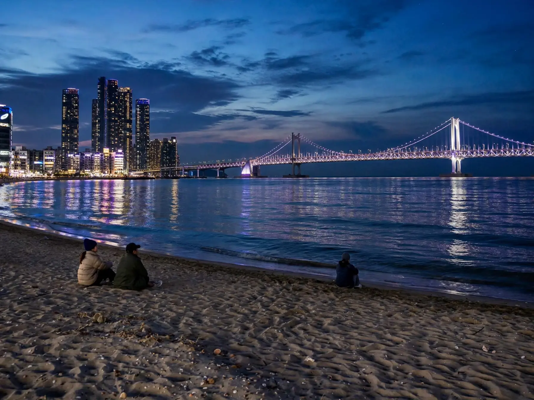 Gwangalli Beach at night with the Gwangandaegyo Bridge lit up, Busan, South Korea